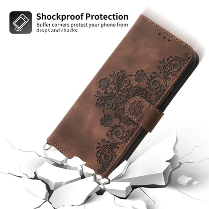 For iPhone 16e Skin-feel Flowers Embossed Wallet Leather Phone Case(Brown) - iPhone 16e Cases by buy2fix | Online Shopping UK | buy2fix